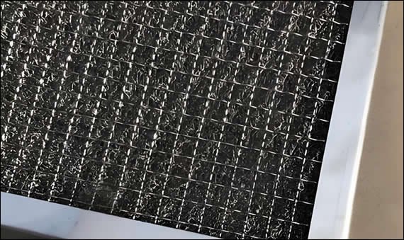 Compressed knitted mesh is formed by pressing knitted wire into dense discs or pads.